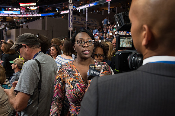 Nina Turner speaks to the press