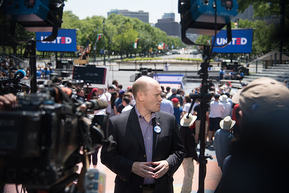 Delaware Senator Chris Coons  speaks to the media.