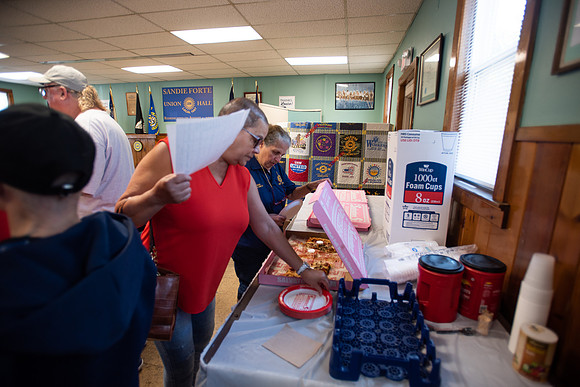 UAW local 1097 members share food and drinks before heading out to the picket line.
