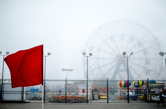 Red warning flags fly at Coney Island before Hurricane Irene hits.