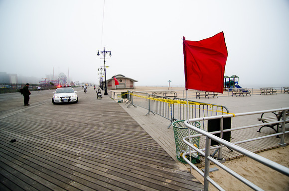 Red warning flags fly at Coney Island before Hurricane Irene hits.