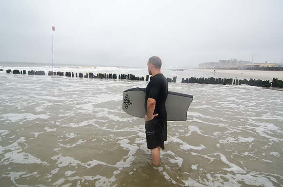 A body surfer contemplates the waves.