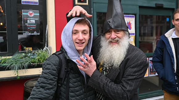 Vermin Supreme takes a photo with a voter.